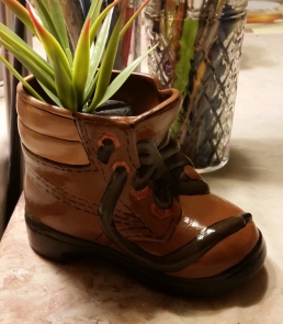 boot planter with plant